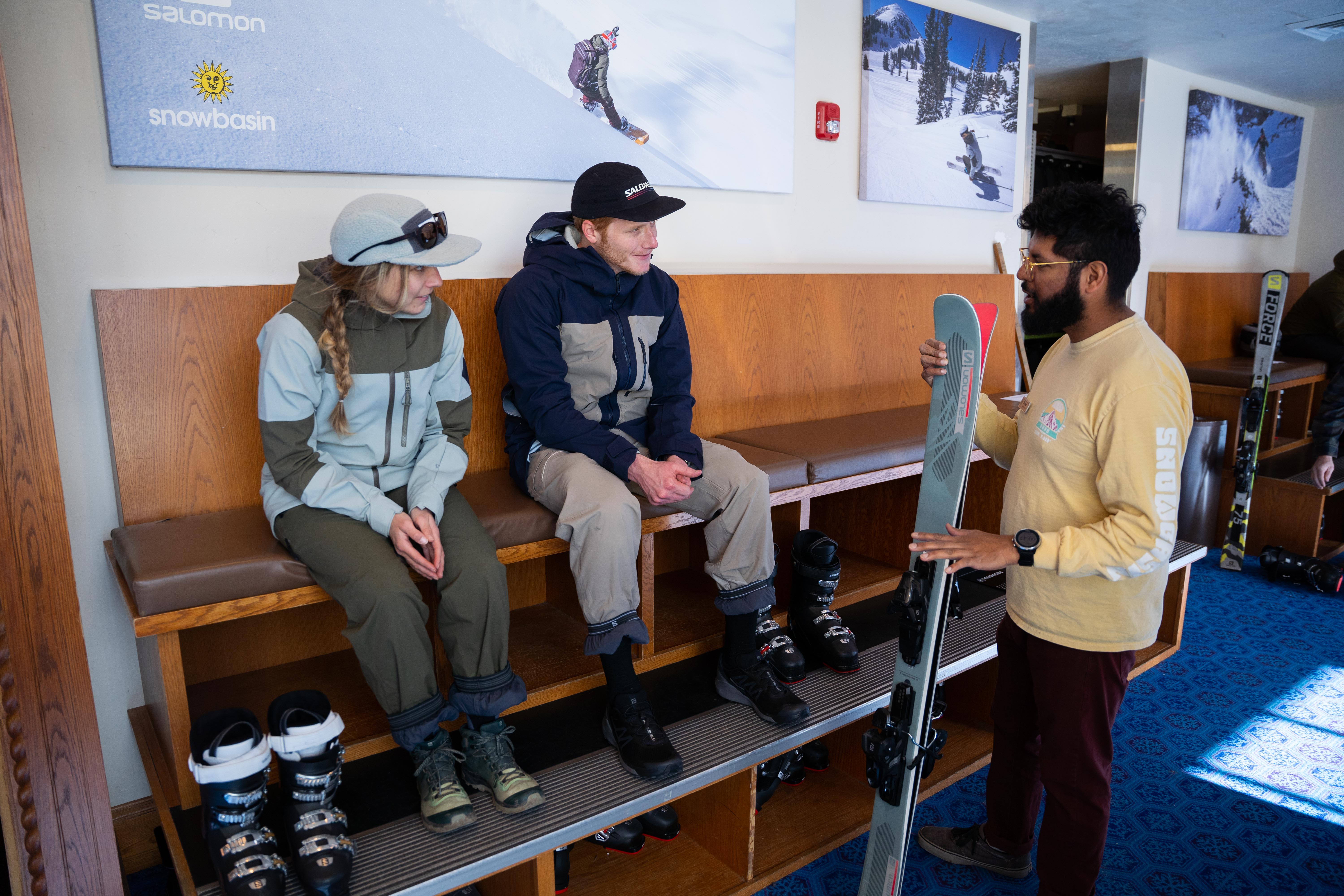 rentals-couple-boot-fitting-employee
