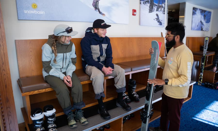 rentals-couple-boot-fitting-employee