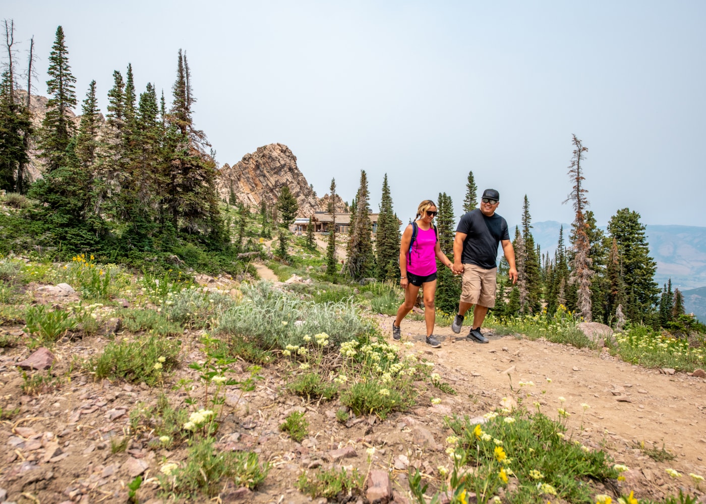 summer-action-hiking-couple-needles-behind.jpg